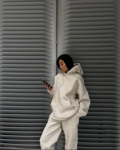 Detailed view of the heavy cotton fabric and oversized fit of the cream tracksuit set