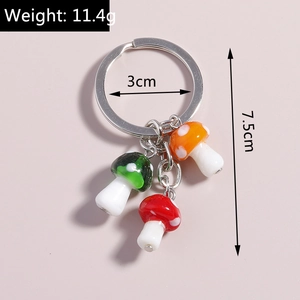 Detailed view of colorful mushroom charms with silver ring, size 7.5cm and 11.4g weight
