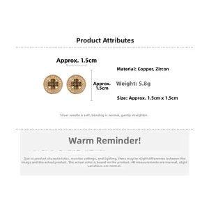 Detail view of round gold plated earrings with black zircon cross and silver pins