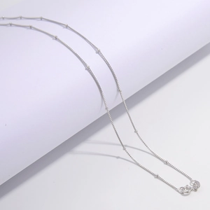 S925 sterling silver box chain necklace with round beads on a clean white background