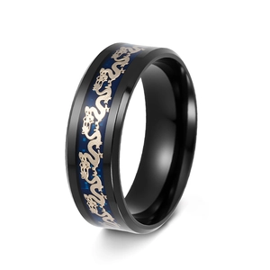 Detail of titanium ring with blue carbon fiber inlay and golden dragon pattern