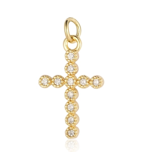 Close-up of golden cross pendant with sparkling round cubic zirconia and top ring loop