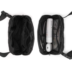 Internal view showing multiple mesh pockets and zipper compartments of the nylon belt bag