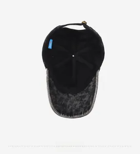 Internal view of the charcoal gray washed denim baseball cap with an adjustable metal strap