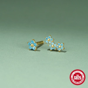 Elegant S925 sterling silver snowflake earrings with gold plating and blue crystals