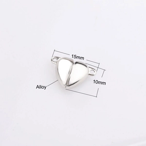 Macro detail of 15mm x 10mm silver alloy heart magnetic clasp for jewelry making