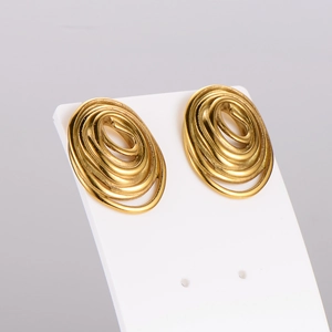 Golden exaggerated spiral oval earrings set with atmospheric metallic texture and lines
