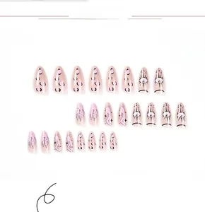 Close-up of long almond press-on nails with aurora eyes and Y2K leopard patterns