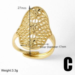 Detailed view of hollow floral gold ring with 27mm height and 17mm inner diameter