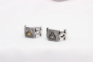 Macro detail of retro stainless steel Masonic Eye of Providence rings for men