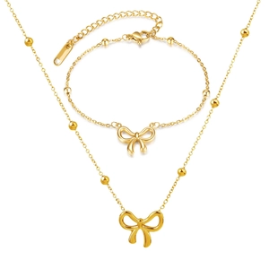 Elegant gold bow pendant necklace and beaded bracelet set in polished titanium steel