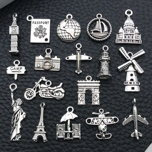 Set of 15 silver metal travel charms including Eiffel Tower and airplane for DIY jewelry