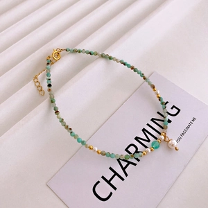 Detailed close-up of Amazonite beads and pearl anklet with gold adjustable chain