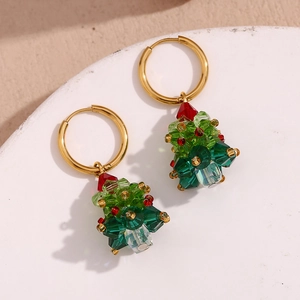 Macro view of Christmas tree earrings with colorful beads on 18K gold plated hoops