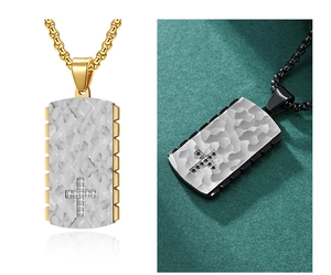 Macro shot of mechanical gear style pendants with textured inlay and cross details
