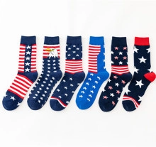 Flat lay detail of six pairs of red white and blue American flag themed crew socks