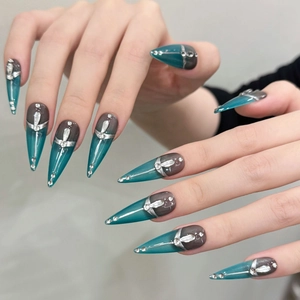 Cyberpunk metallic green long stiletto press-on nails with silver cross and rhinestones