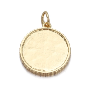 Detailed close-up of golden round pendant with hammer texture and gear edge design