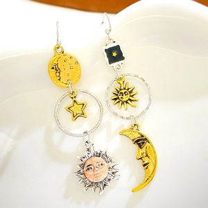 Bohemian sun and moon tassel drop earrings with celestial gold and silver star elements