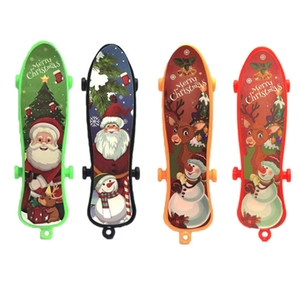 Mini plastic finger skateboards with festive Christmas patterns in four colors