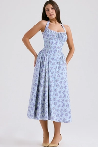 Close-up of floral print summer midi dress featuring halter neck and ruched bodice detail