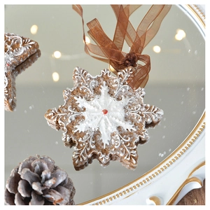Close-up of snowflake gingerbread ornament with resin texture on a vintage mirror