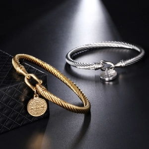 Classic cable twist bangle in gold and silver finish with engraved coin pendant