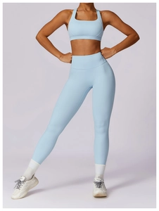 Detail of light blue racerback yoga bra and high waist leggings for fitness sports