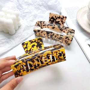 Set of two 13cm large acetate hair claws with classic tortoiseshell and amber patterns