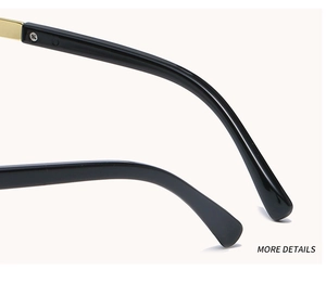 Close-up of black acetate temple and gold metal hinge on fashion oversized sunglasses