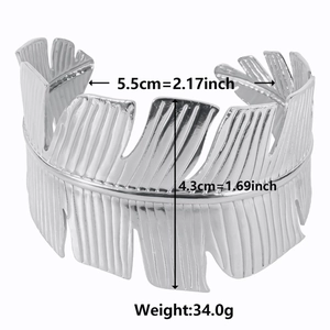 Silver wide cuff open bangle with feather-textured stripes and adjustable metal design