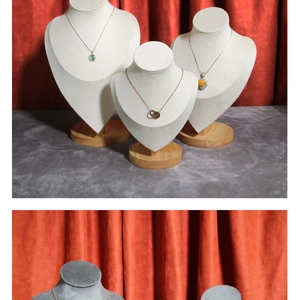 Necklace display bust featuring linen and velvet textures with a solid wooden base