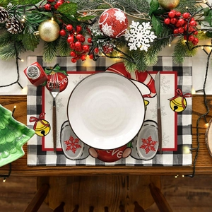 Close-up of a Christmas placemat with gnomes and 'Believe' text on a wooden dining table