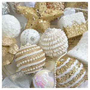 Close-up of champagne gold glitter stars, pearl ornaments and bells for Christmas tree