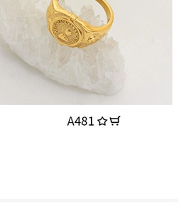 Macro shot of gold vintage coin ring on white crystal stones showing relief details