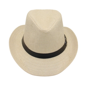 Detail of the breathable paper straw weave and black leather band with metal buckle on the hat