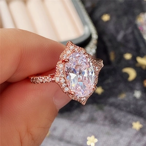 Elegant rose gold halo ring with large oval cut cubic zirconia and pave band for women