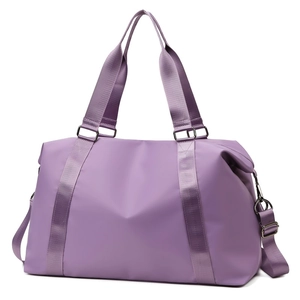 Detail of waterproof nylon lilac travel bag showing durable gunmetal hardware and straps