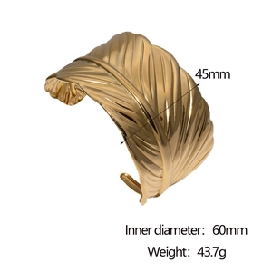 Detail view of gold leaf bangle with 45mm width and 60mm inner diameter dimensions
