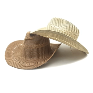 Western style woven straw cowboy hats in beige and dark brown with rolled brims