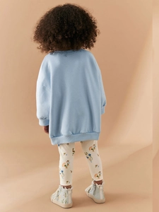 Girls long-sleeve blue sweatshirt and floral print leggings set viewed from the back