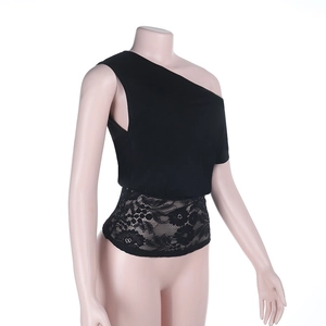 Detail of black one-shoulder top showing hollow floral lace stitching and knit texture