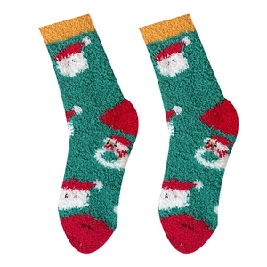 Green coral fleece Christmas socks with white snowman pattern and red heel for winter warmth