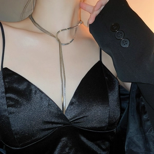 Elegant long silver snake chain necklace with metallic tassel for women's fashion