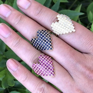 Three-piece set of heart-shaped micro-pave rings in blue, pink, and silver crystals