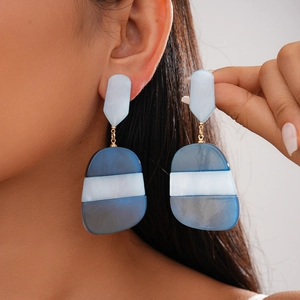 Geometric acetate oval drop earrings with blue marble texture and gold connectors