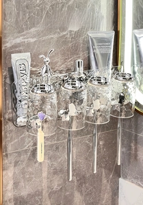 Close-up of wall-mounted clear glacier texture toothbrush holder with 4 glass cups