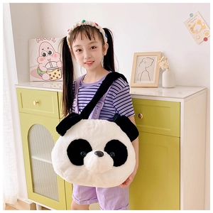 Detail view of the soft panda plush crossbody bag worn with a casual striped outfit