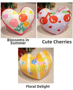 Detailed view of heart-shaped plush pillows in tulip, cherry, and floral patterns