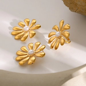 Golden sunflower jewelry set featuring 18k gold earrings and a pearl open ring